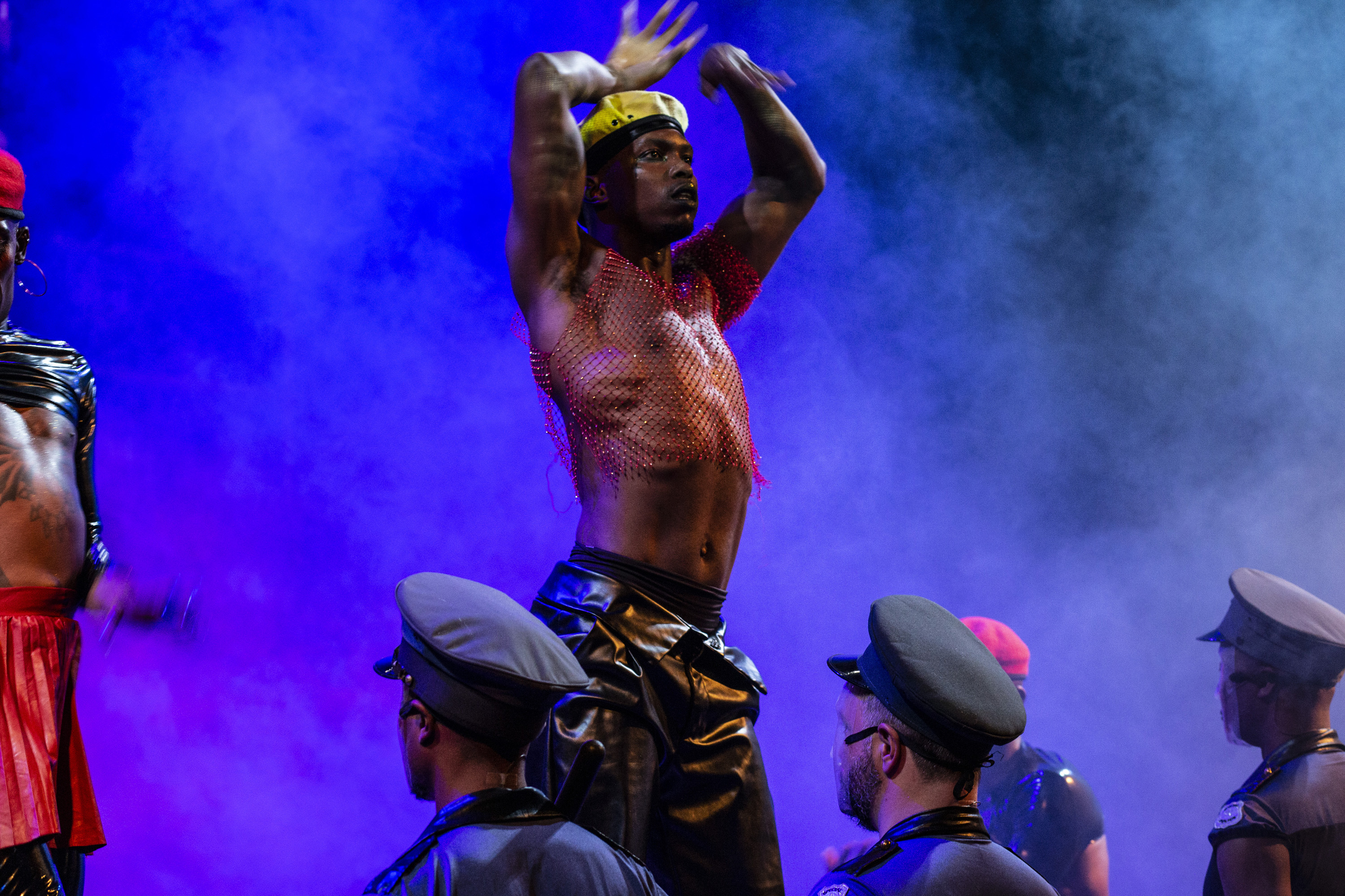 Vogue-dancer Lebhohang Otukile confronts the apartheid police in a scene from Nkoli: The Vogue-Opera. © Mark Lewis