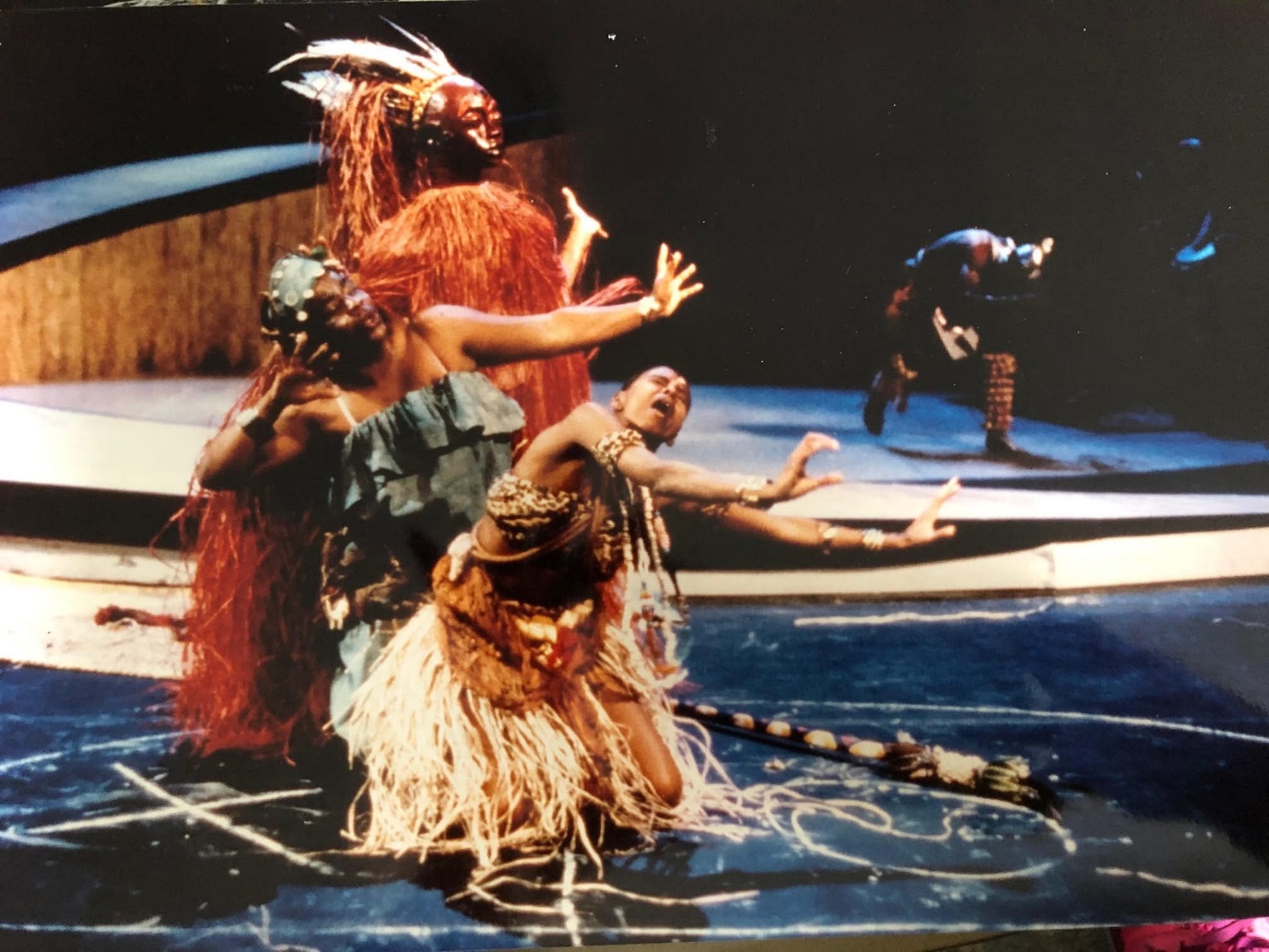 <i>Production shot from</i> Njinga <i>presented at Brooklyn Academy of Music 1993, used by permission.</i> A group of people performing on a stage AI-generated content may be incorrect.